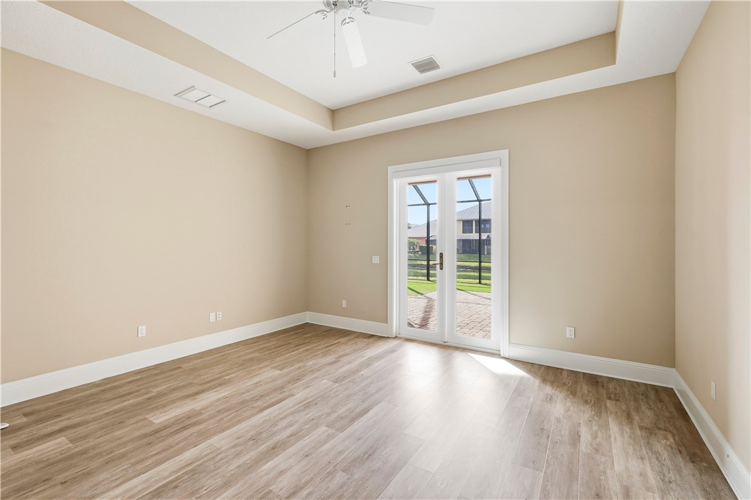 2030 Bridgepointe Circle, Unit 112 Vero Beach, FL 32967 - Photo 12 of 36 wooden floor in an empty room with a window