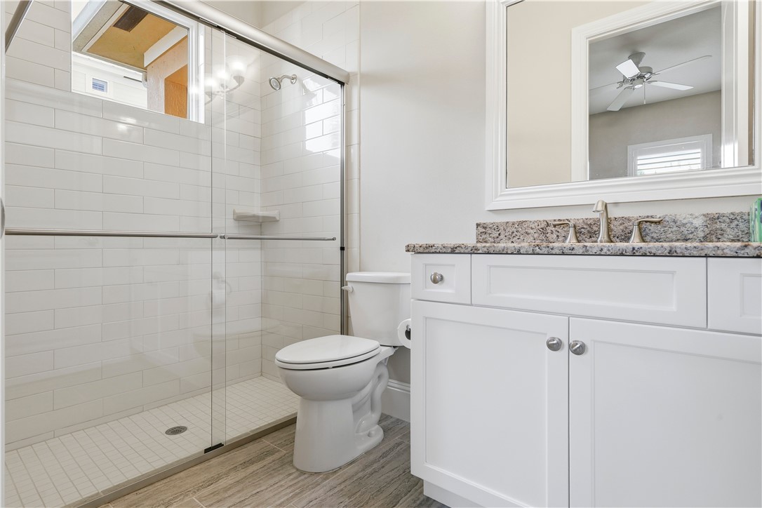 2030 Bridgepointe Circle, Unit 112 Vero Beach, FL 32967 - Photo 15 of 36 a bathroom with a sink toilet and shower