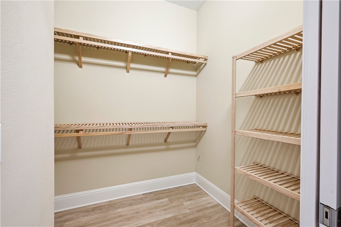 2030 Bridgepointe Circle, Unit 112 Vero Beach, FL 32967 - Photo 16 of 36 a view of walk in closet with empty racks