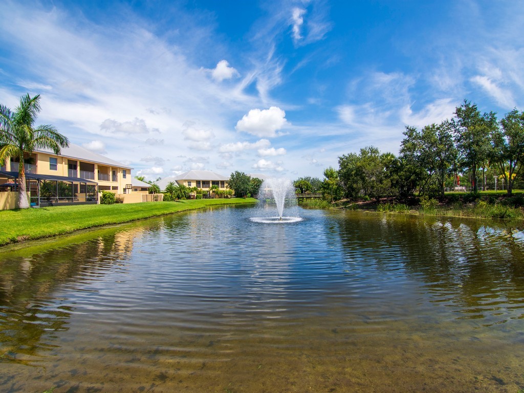 2030 Bridgepointe Circle, Unit 112 Vero Beach, FL 32967 - Photo 26 of 36 a view of building with river in front of it