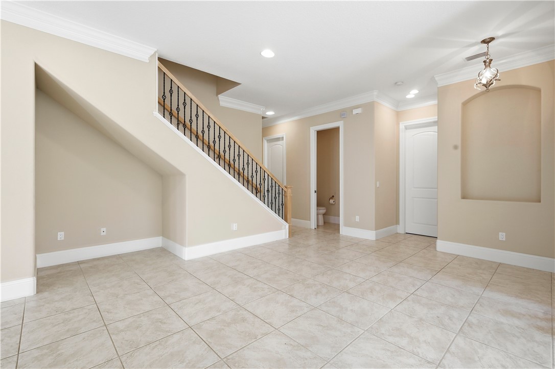 2030 Bridgepointe Circle, Unit 112 Vero Beach, FL 32967 - Photo 3 of 36 a view of an entryway with wooden floor