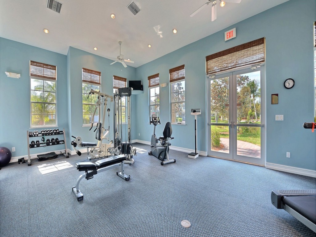2030 Bridgepointe Circle, Unit 112 Vero Beach, FL 32967 - Photo 34 of 36 a view of a room with gym equipment