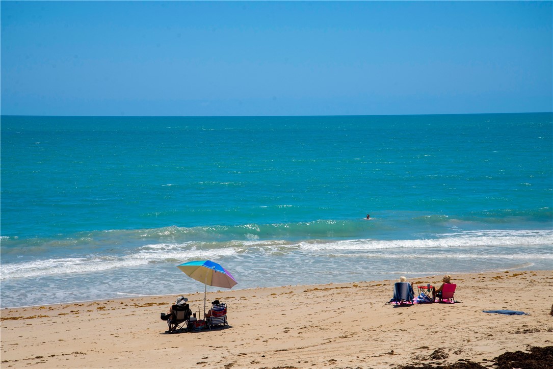 2030 Bridgepointe Circle, Unit 112 Vero Beach, FL 32967 - Photo 36 of 36 a view of a lake with a beach