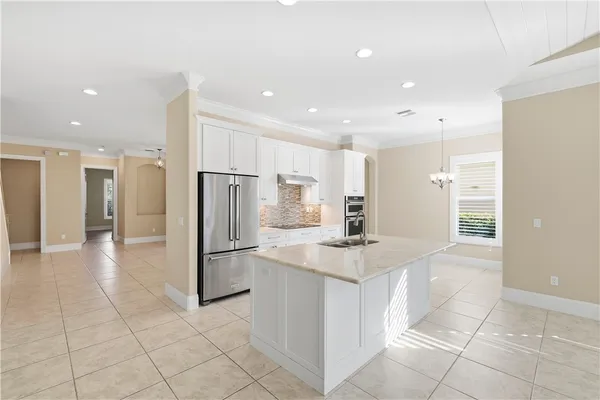 a kitchen with stainless steel appliances a refrigerator and a sink