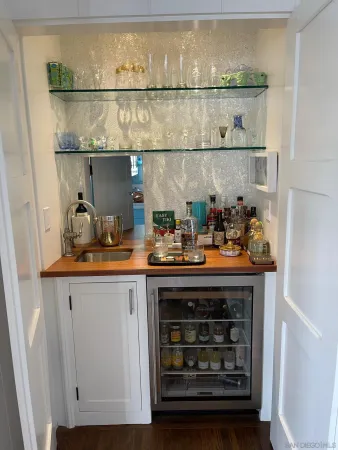 a room with a fireplace and cabinets