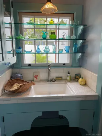a kitchen with a sink and a window