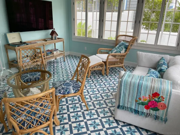 a living room with furniture and a floor to ceiling window
