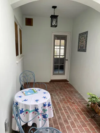 a bedroom with a bed and a potted plant