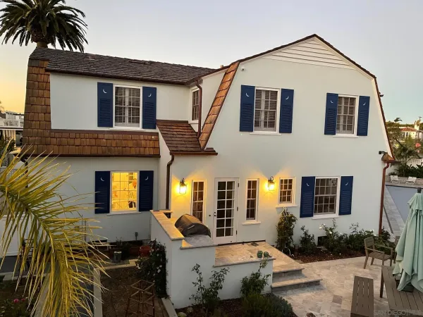 a front view of house with yard outdoor seating and barbeque oven
