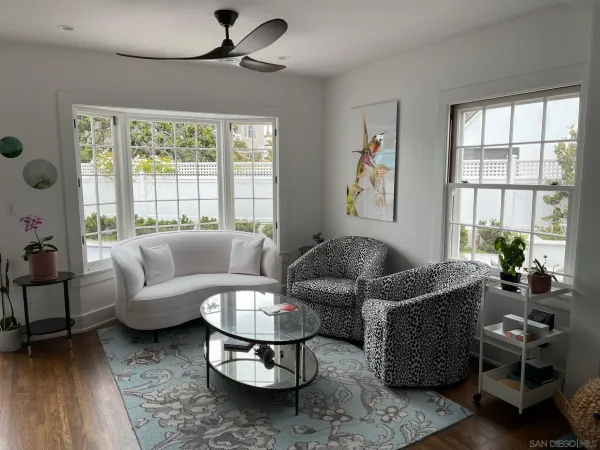 a living room with furniture and a large window