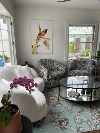 a bedroom with furniture and a window