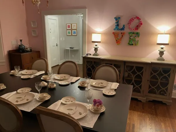 a dining room with furniture and wooden floor