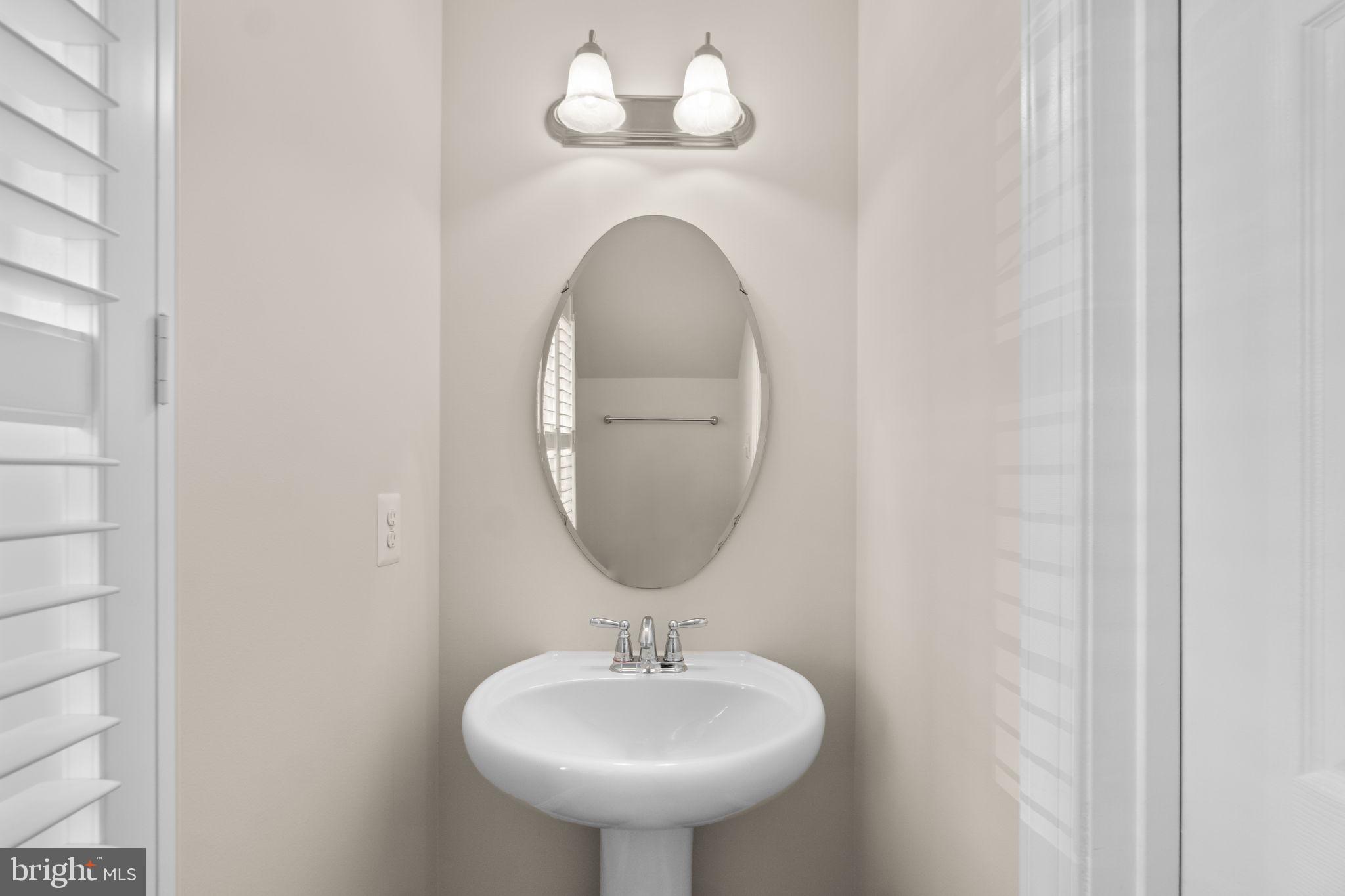 3624 Spring Hollow Lane Frederick, MD 21704 - Photo 14 of 46 a bathroom with a sink and a mirror