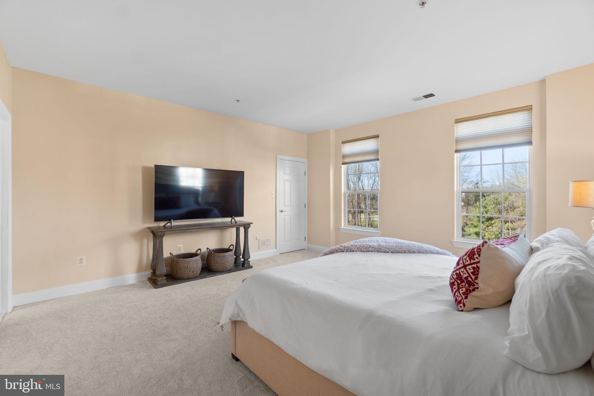 3624 Spring Hollow Lane Frederick, MD 21704 - Photo 15 of 46 a bedroom with a flat screen television and a bed