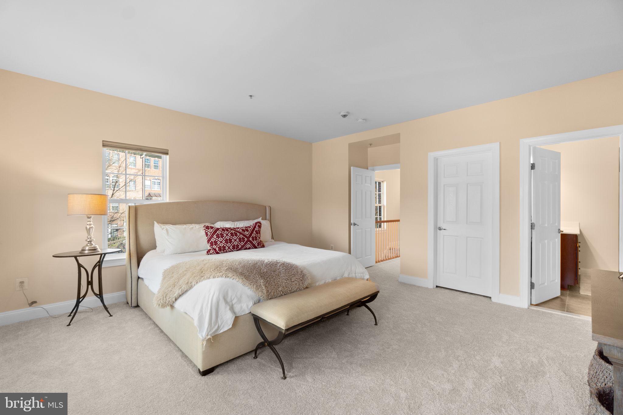 3624 Spring Hollow Lane Frederick, MD 21704 - Photo 16 of 46 a spacious bedroom with a bed and a lamp