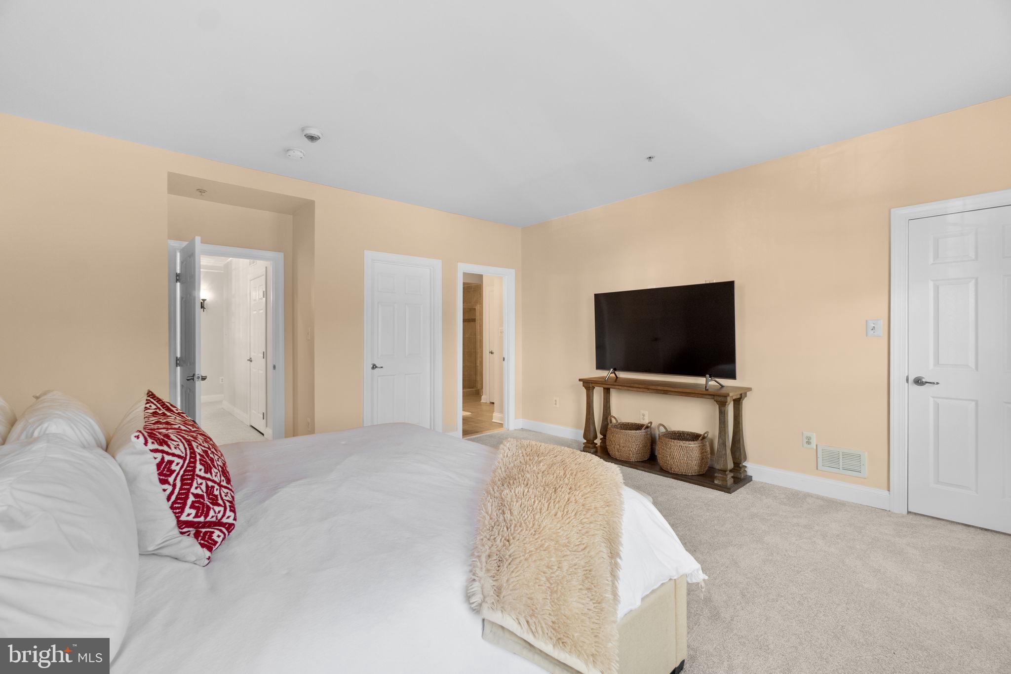 3624 Spring Hollow Lane Frederick, MD 21704 - Photo 17 of 46 a bedroom with a bed and a television in it