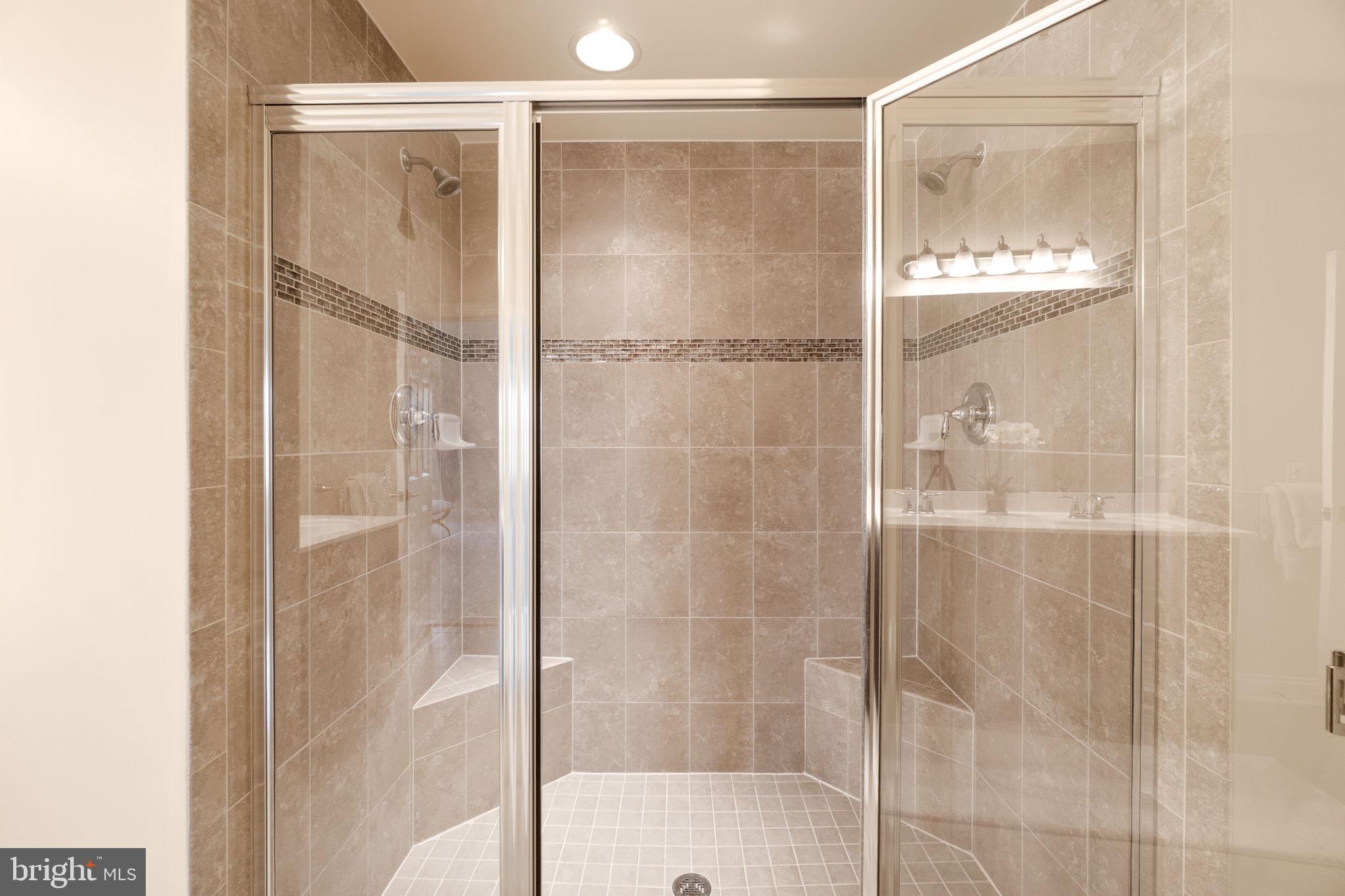 3624 Spring Hollow Lane Frederick, MD 21704 - Photo 19 of 46 a bathroom with a glass shower door