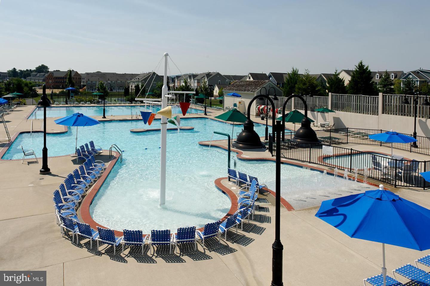 3624 Spring Hollow Lane Frederick, MD 21704 - Photo 38 of 46 a view of a swimming pool with a patio and dining space