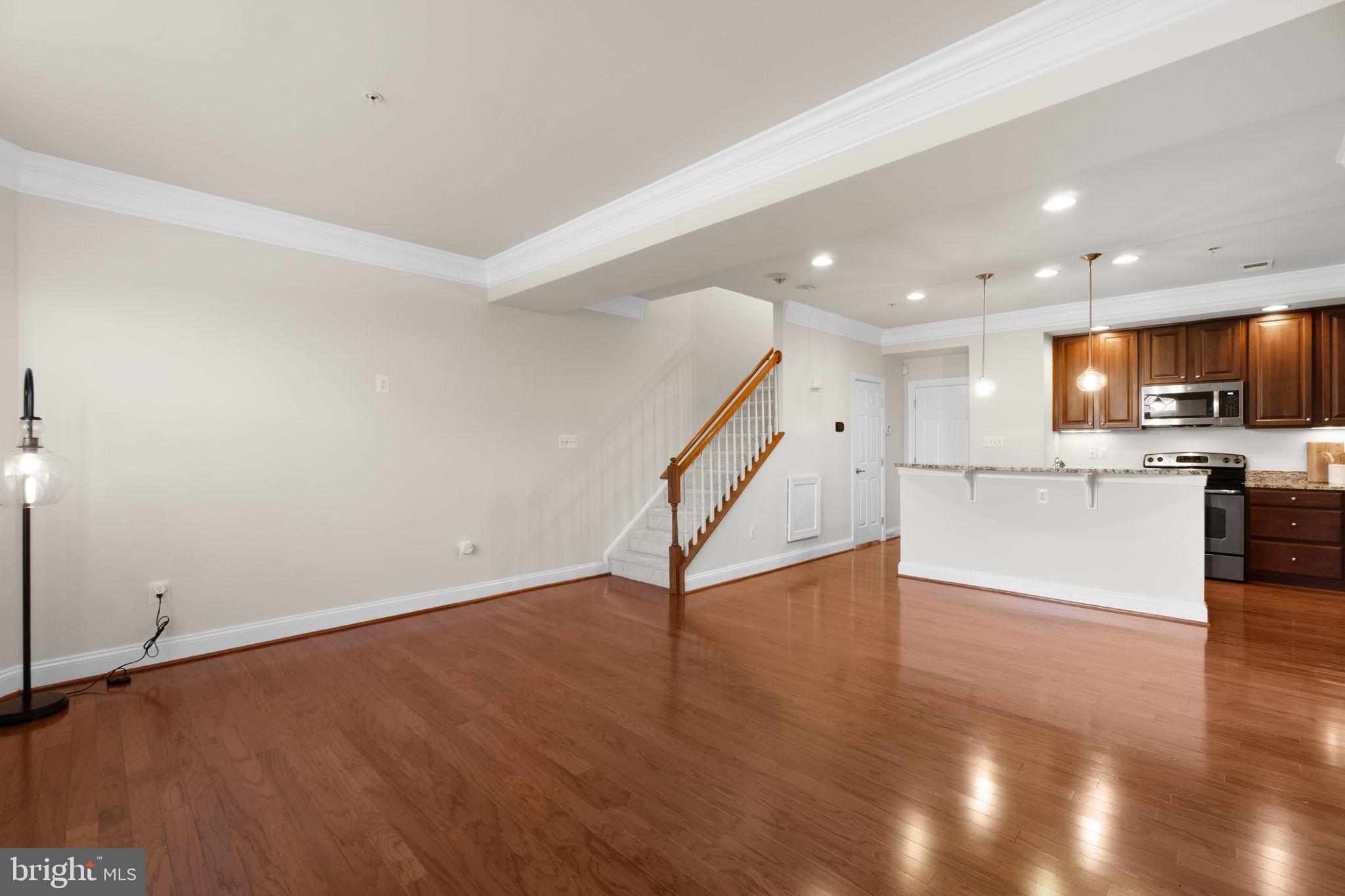 3624 Spring Hollow Lane Frederick, MD 21704 - Photo 4 of 46 a view of a kitchen with wooden floor and electronic appliances