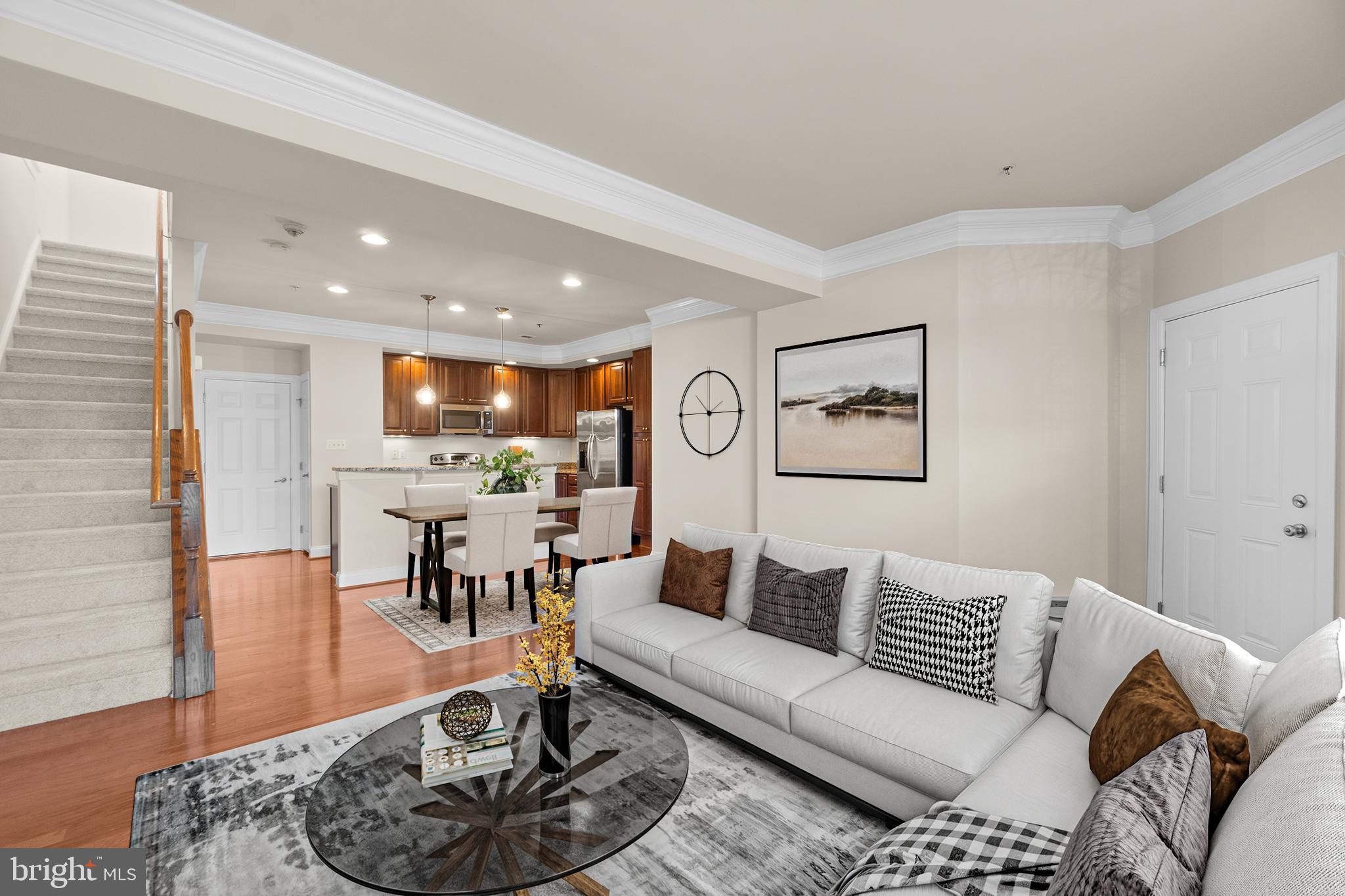 3624 Spring Hollow Lane Frederick, MD 21704 - Photo 7 of 46 a living room with furniture and a dining table with kitchen view