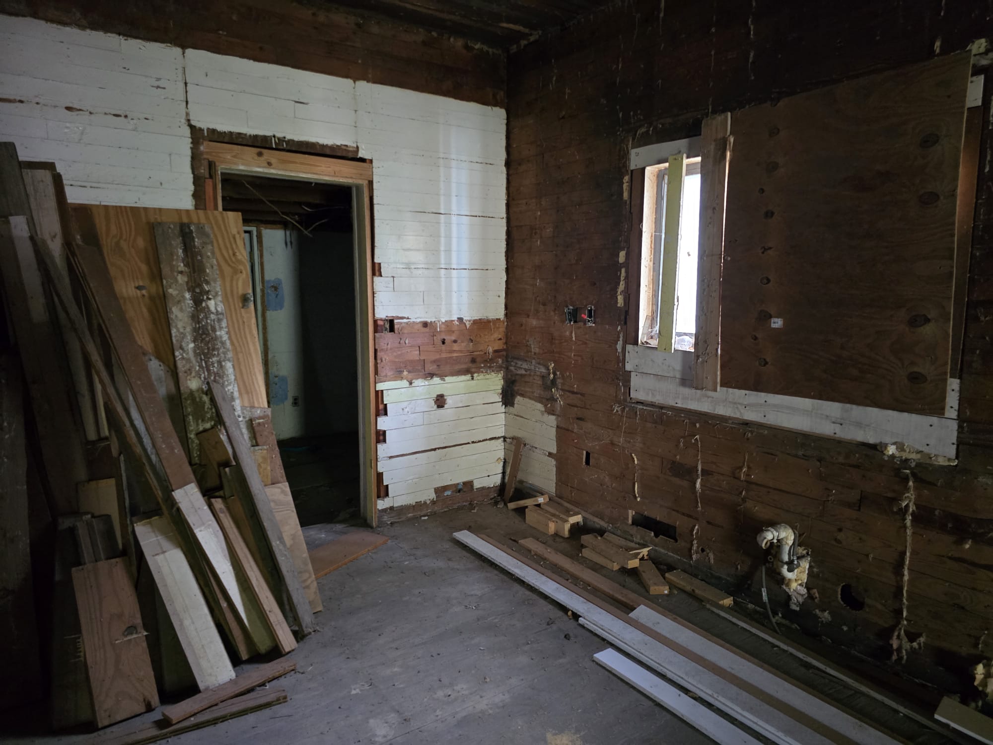 901 West 5th Street Taylor, TX 76574 - Photo 15 of 21 a room with water heater and a wooden door