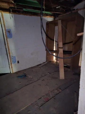 a bathroom with a shower and a sink