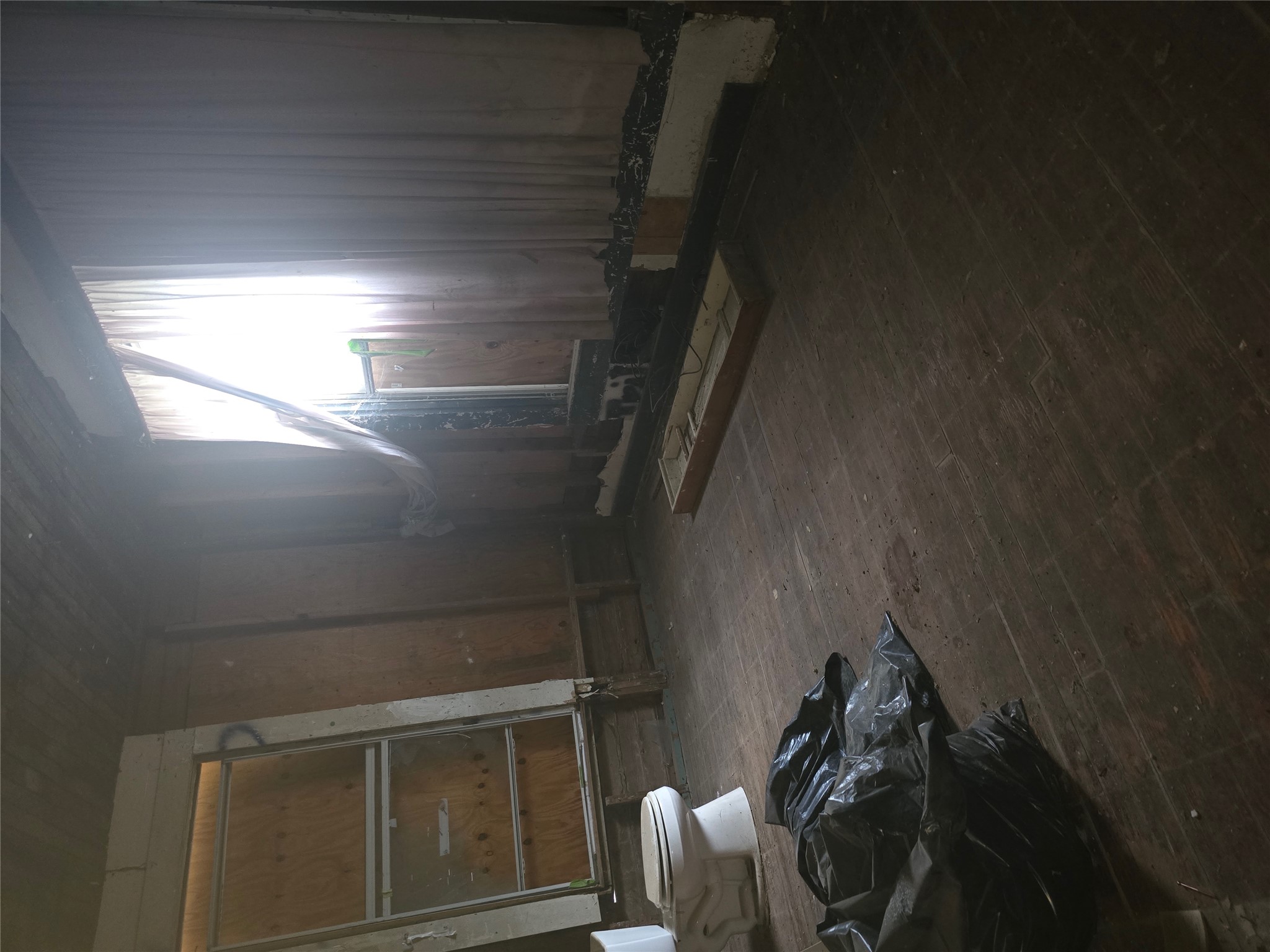 901 West 5th Street Taylor, TX 76574 - Photo 5 of 21 a view of a livingroom with wooden floor and a window