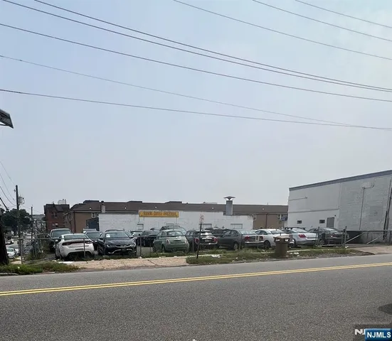 a view of a city street with tall buildings