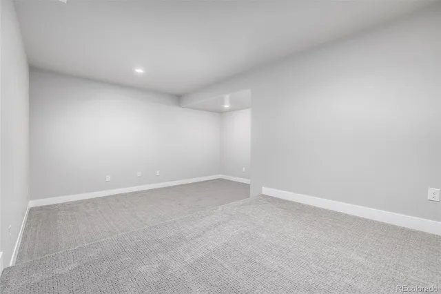 an empty room with a empty space and window