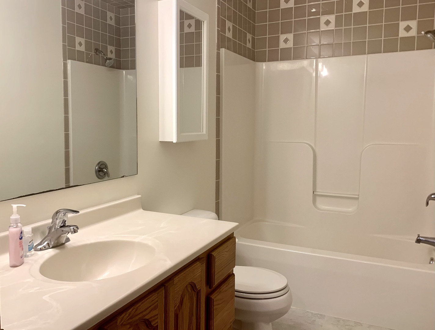 686 South Peace Road, Unit 686 Sycamore, IL 60178 - Photo 12 of 15 a bathroom with a sink toilet vanity and shower
