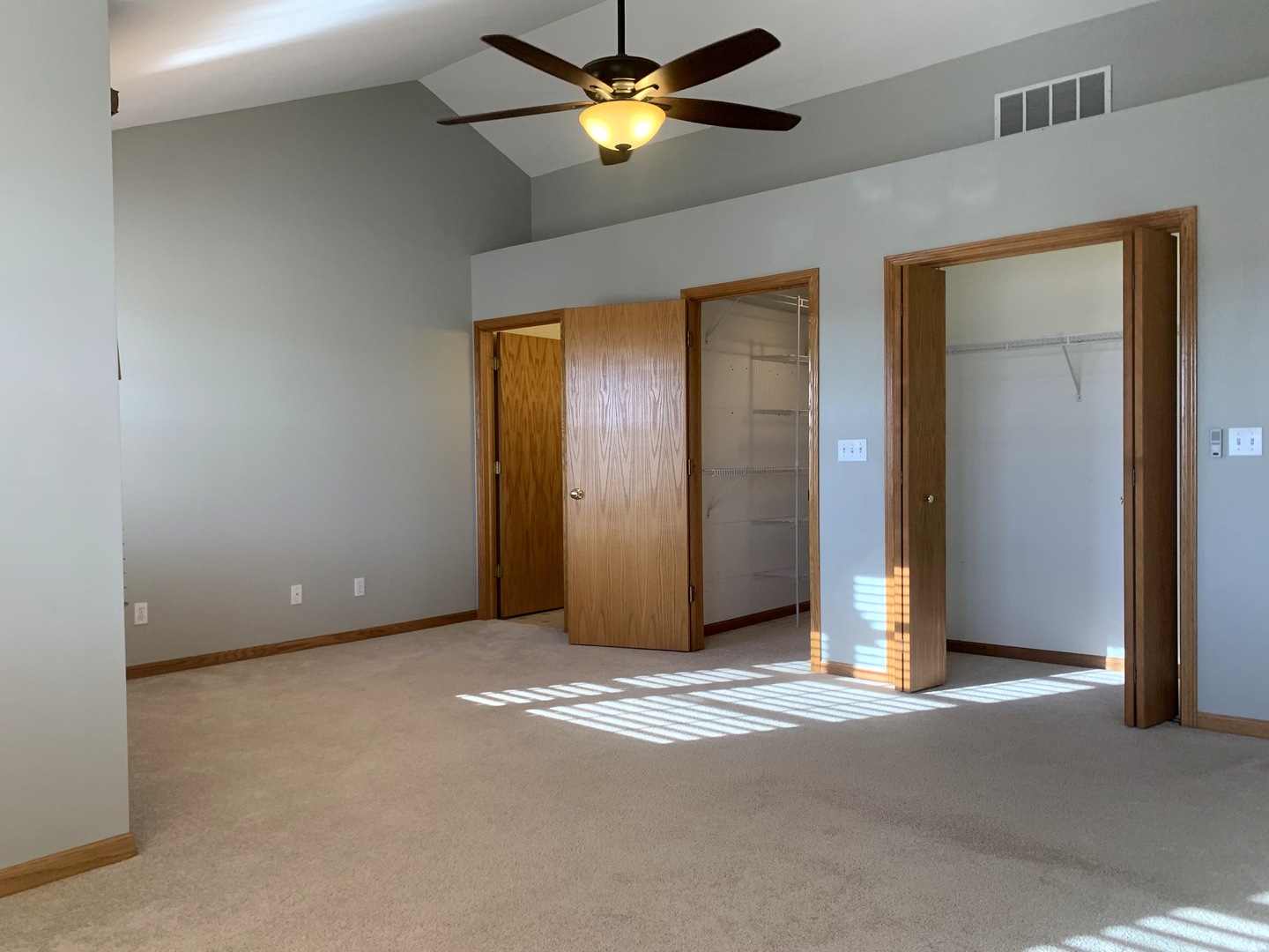 686 South Peace Road, Unit 686 Sycamore, IL 60178 - Photo 8 of 15 a view of an empty room with a fan