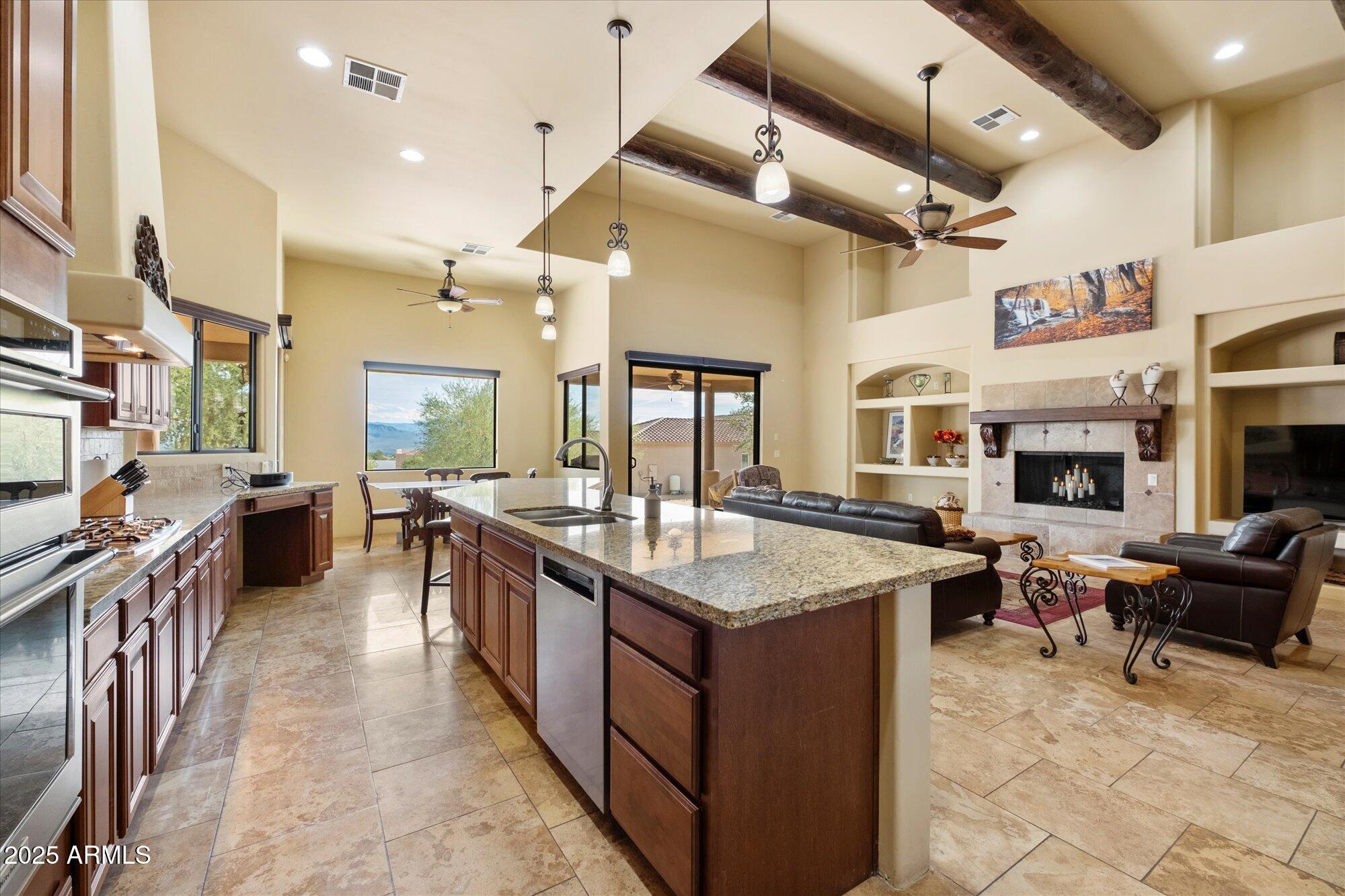 29317 North 164th Street Scottsdale, AZ 85262 - Photo 11 of 27 a large kitchen with stainless steel appliances lots of counter space and windows