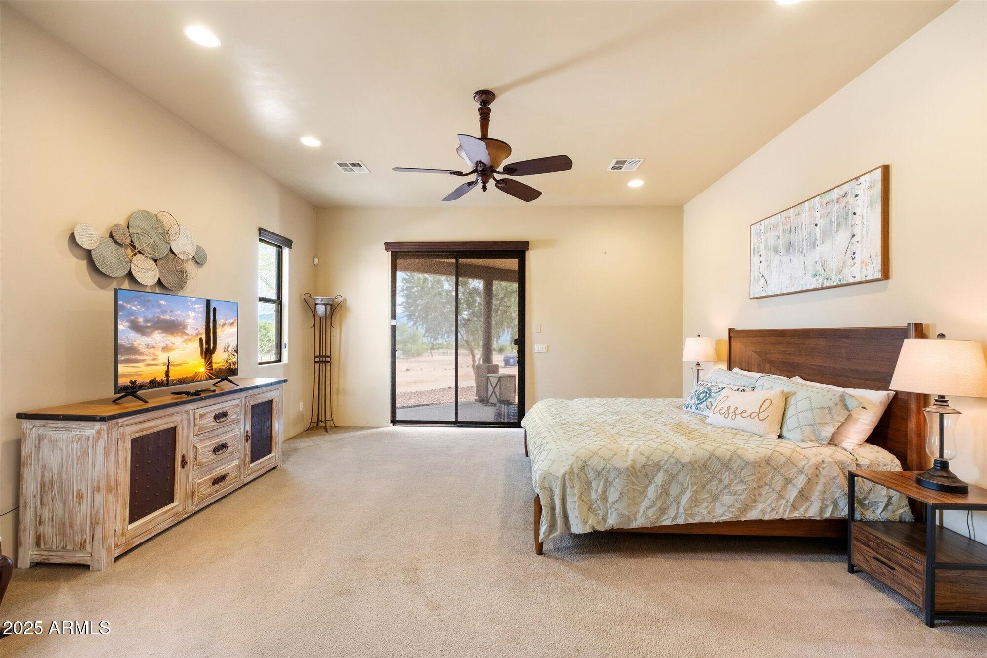 29317 North 164th Street Scottsdale, AZ 85262 - Photo 13 of 27 a bedroom with a bed and a flat screen tv