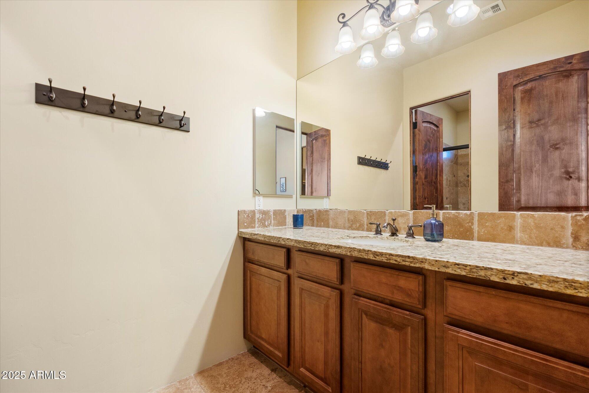 29317 North 164th Street Scottsdale, AZ 85262 - Photo 19 of 27 a bathroom with a double vanity sink and mirror