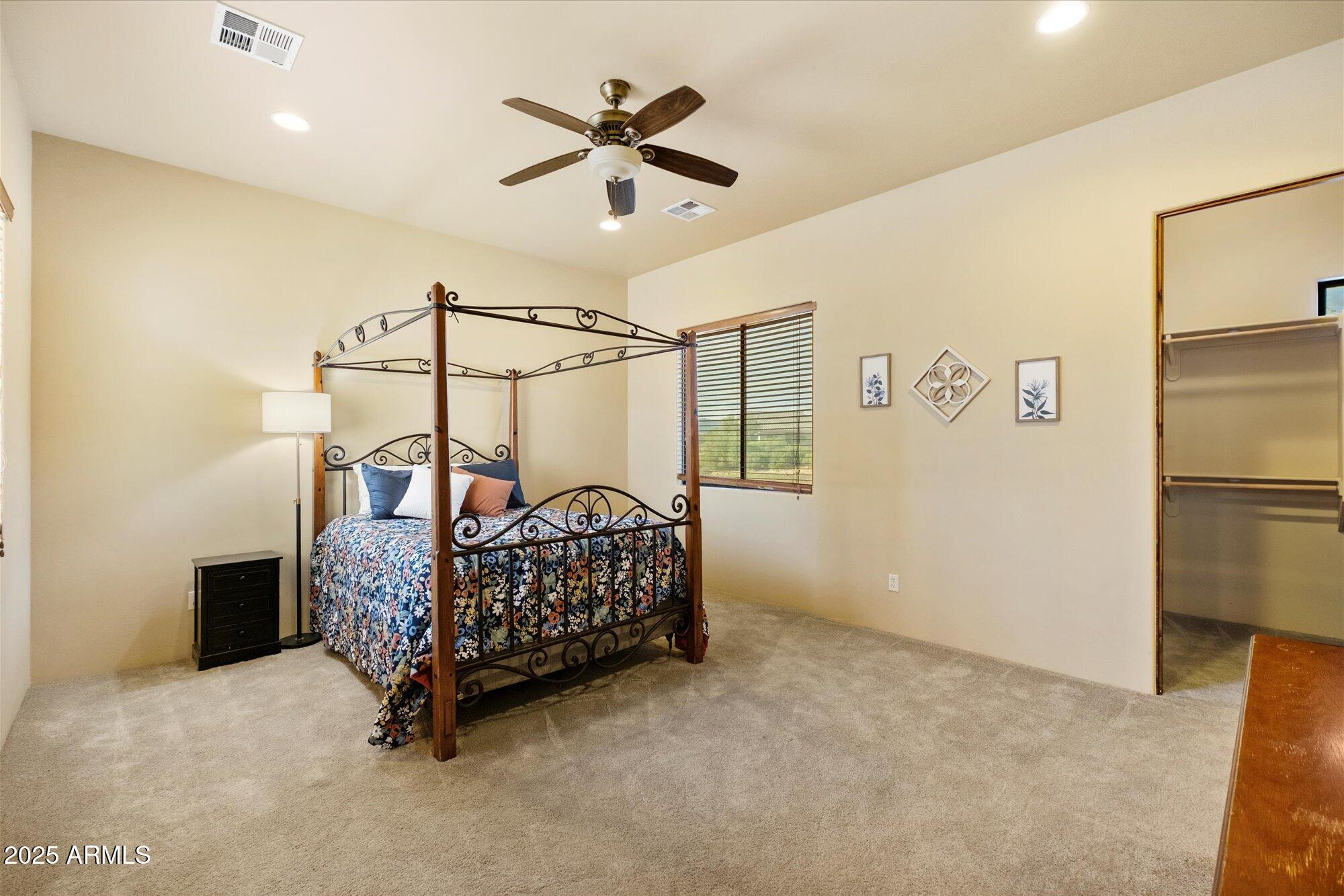 29317 North 164th Street Scottsdale, AZ 85262 - Photo 20 of 27 a bedroom with a bed and a ceiling fan