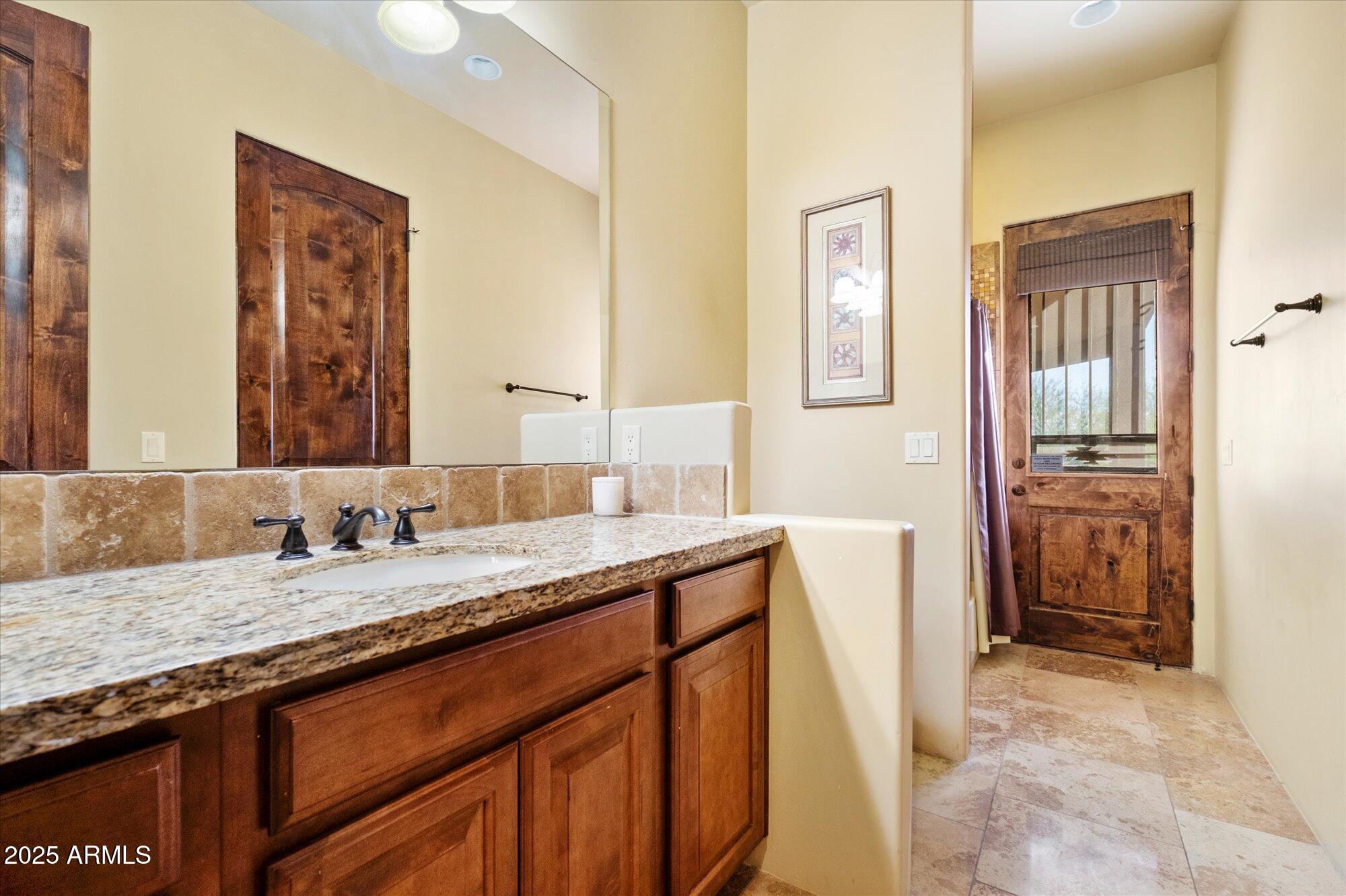 29317 North 164th Street Scottsdale, AZ 85262 - Photo 21 of 27 a bathroom with a granite countertop sink and a mirror