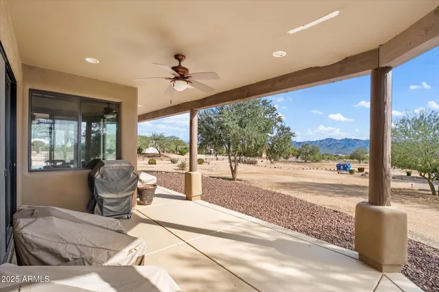 a living room with hardwood floor and balcony view