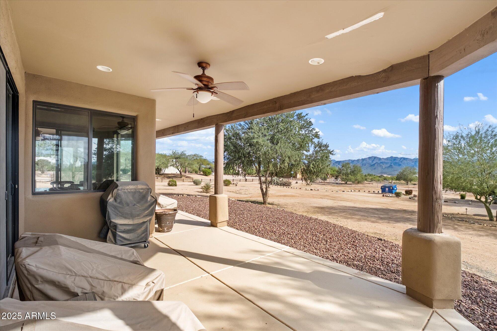 29317 North 164th Street Scottsdale, AZ 85262 - Photo 24 of 27 a living room with hardwood floor and balcony view