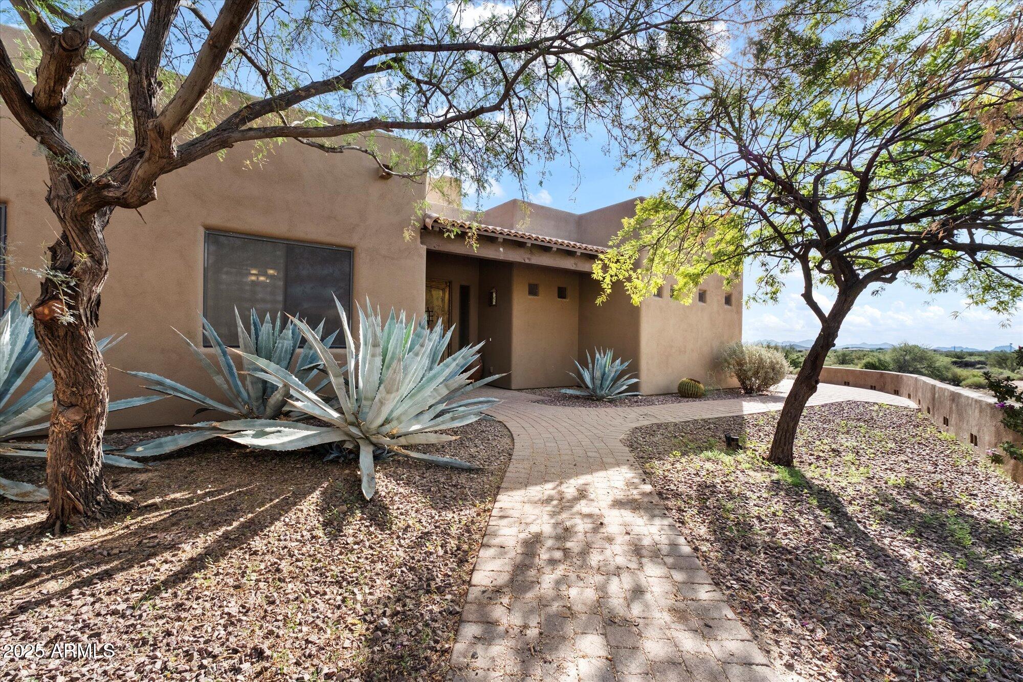 29317 North 164th Street Scottsdale, AZ 85262 - Photo 3 of 27 a view of a house with a snow in a yard