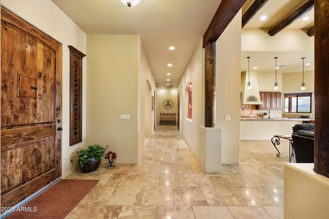 a view of a hallway with dining area