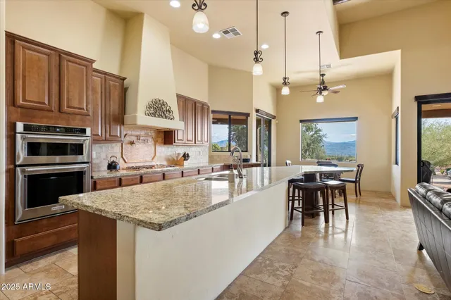 a large kitchen with kitchen island a large island in the center