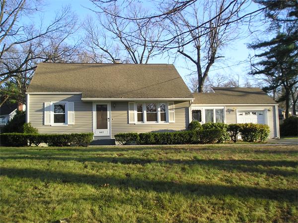 661 Plumtree Road Springfield, MA 01118 - Photo 1 of 10 a front view of a house with a yard table and chairs