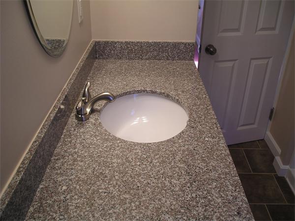 661 Plumtree Road Springfield, MA 01118 - Photo 9 of 10 a bathroom with a granite countertop sink and a mirror