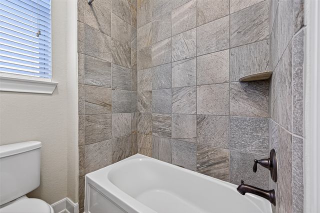 a bathroom with a sink and toilet