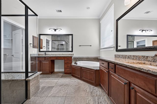 a kitchen with stainless steel appliances granite countertop a sink and stove top oven