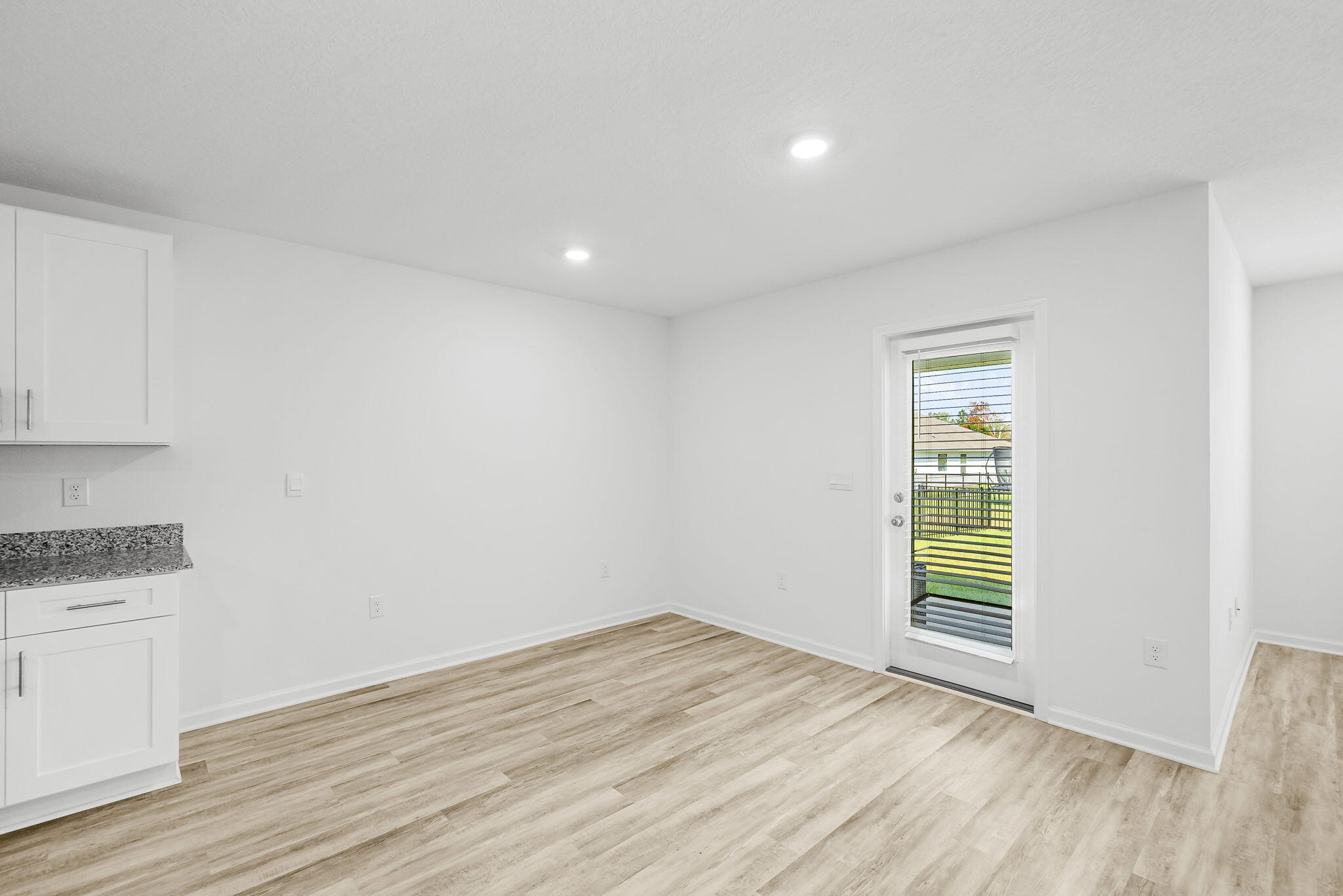 39 Riverwalk Crossing Freeport, FL 32439 - Photo 11 of 32 a view of a kitchen with wooden floor and a window