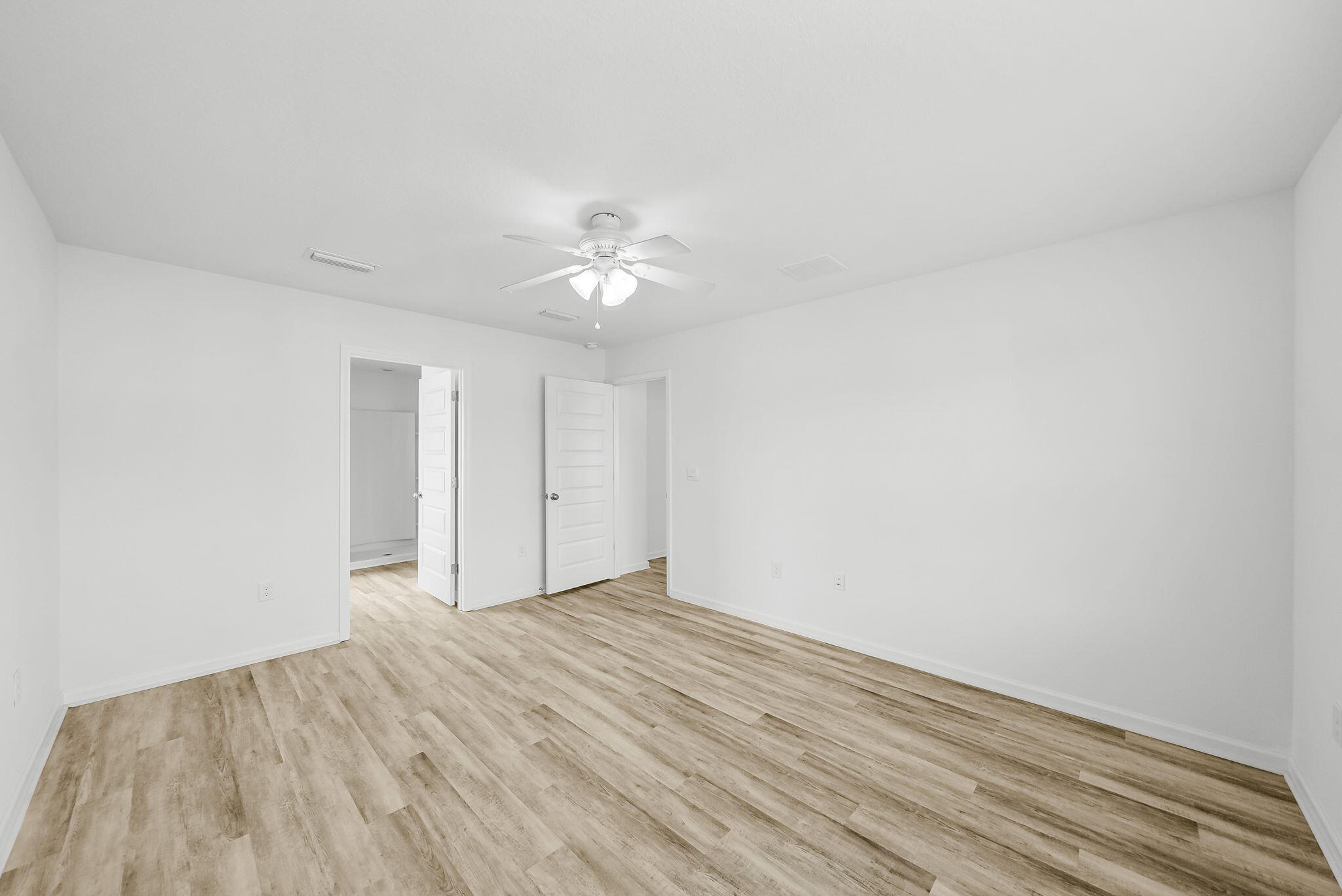 39 Riverwalk Crossing Freeport, FL 32439 - Photo 18 of 32 a view of an empty room with wooden floor