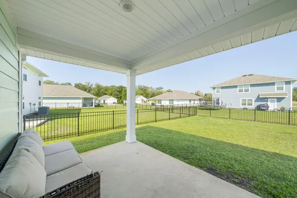 a view of a water fountain and a big yard