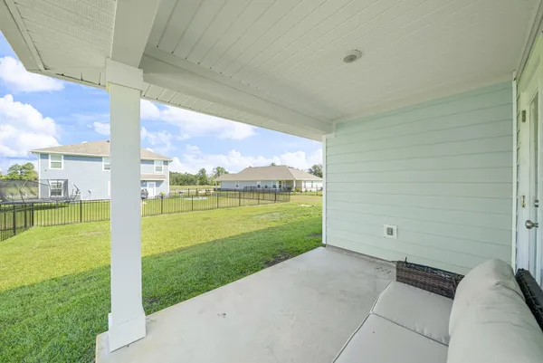a view of a backyard of the house