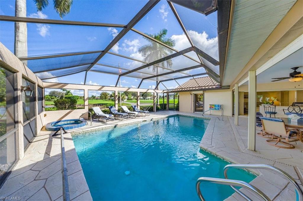 1101 Foxfire Lane Naples, FL 34104 - Photo 14 of 38 a view of swimming pool with outdoor seating